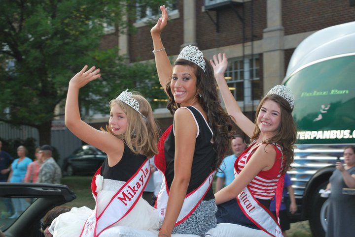 NAM Titleholders have fun making an appearance in a community parade.